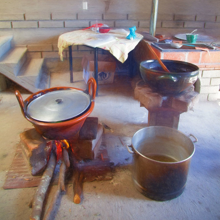 Open kitchen with mole negro on the fire