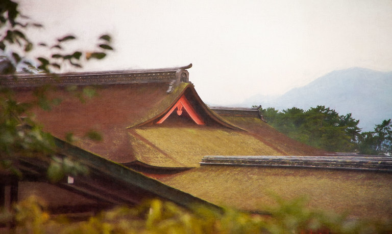 Shrine roof and mountains in the mist